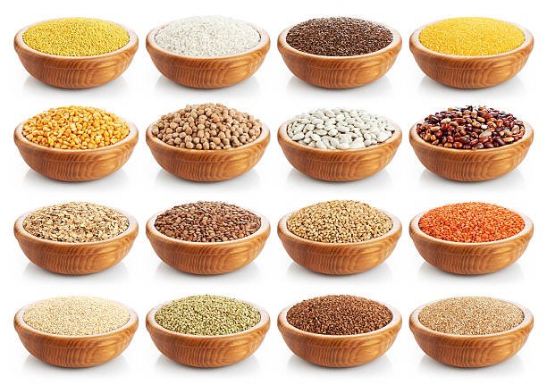 Wooden bowl with porridge, cereals, lentils, peas and beans isolated on white background. Collection.